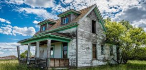 Home in Need of Repairs - An image depicting a home in disrepair, showcasing key problems that make a property distressed.